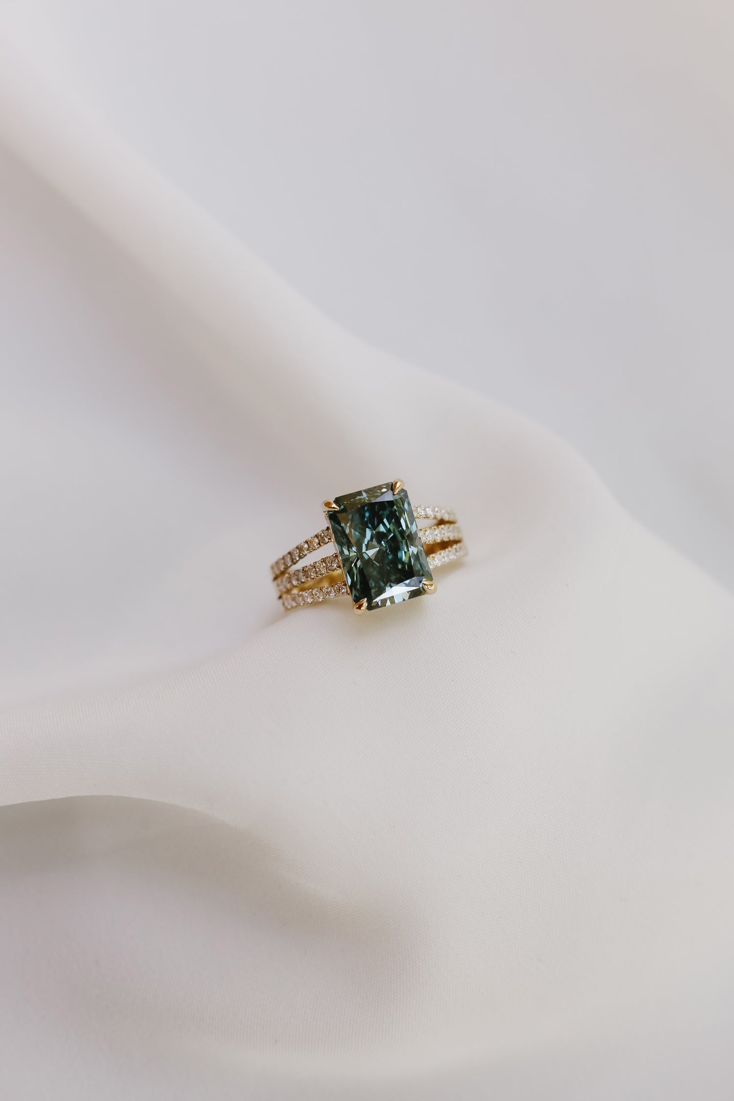 14k yellow gold 4.74ct Deep Blue Diamond with 3 diamond band