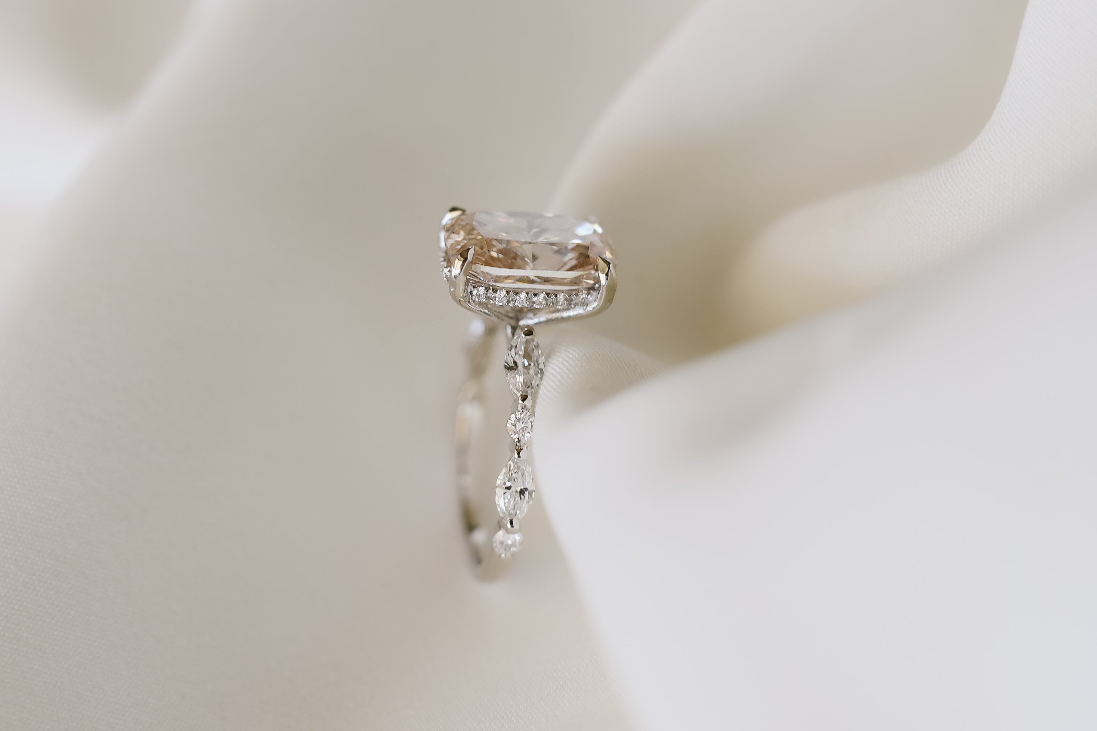 Pink diamond ring with hidden halo and unique setting